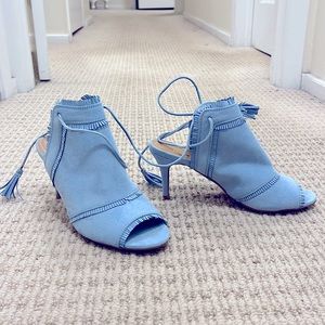 Really pretty light blue, suede, lace up heels. Never been worn